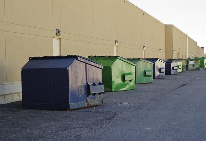 a row of industrial dumpsters at a construction site in Haverhill, FL